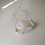 Mushie Silicone Baby Bib – Adjustable Catch-All Bib