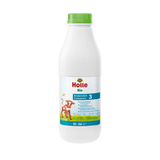 Holle organic milk bottle on a white background