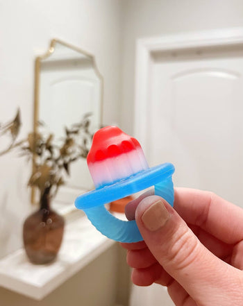 Bitzy Biter™ Teething Ball – Pink Lemonade Silicone Baby Teether