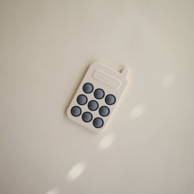 Mushie Phone Press Toy – Sensory Pop Toy for Babies