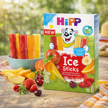 Hipp Ice Sticks packaging with colorful ice sticks and fruits on a wooden table