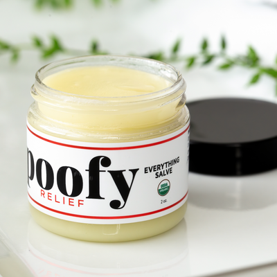 Poofy Organics Everything Salve 2oz container shown with organic topical skin care packaging
