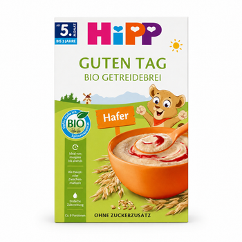 A package of Hipp 'Guten Tag' organic rice cereal, featuring a white and green box with illustrations of a cartoon bear, a bowl of cereal, and oat grains.