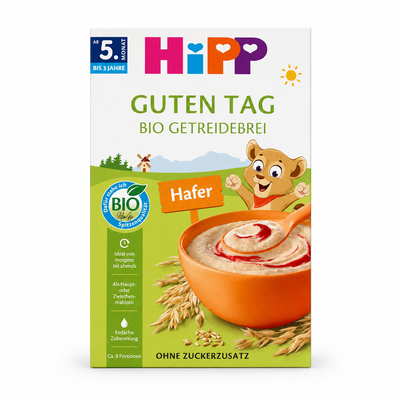 A package of Hipp 'Guten Tag' organic rice cereal, featuring a white and green box with illustrations of a cartoon bear, a bowl of cereal, and oat grains.