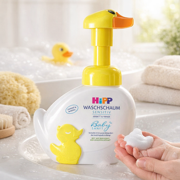 Bottle of Hipp baby soap with a yellow duck design on a bathroom counter.