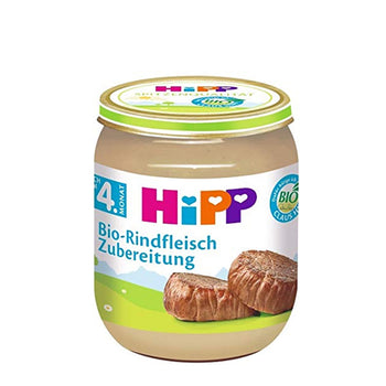 Hipp baby food jar with bread slices on a white background