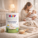 Hipp goat milk formula can with a mother and baby in the background