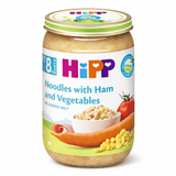 Jar of HiPP baby food with noodles, ham, and vegetables on a white background