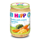 Jar of HiPP noodles with creamy vegetables on a white background