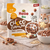 Holle Bio Choco Chipmunk crispy cereals packaging with a bowl of cereal and a toy on a wooden surface.