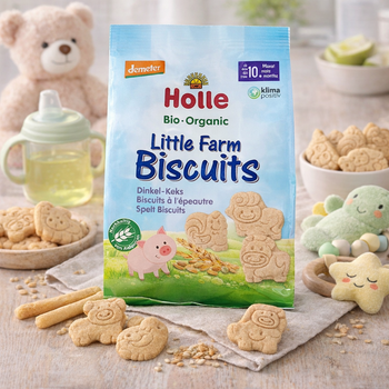 Holle organic Little Farm Biscuits packaging with cookies and a teddy bear in the background