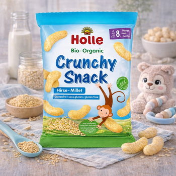 Holle organic crunchy snack package with ingredients and a teddy bear in the background