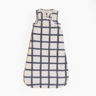 Indigo Windowpane Blanket Sleeper wearable baby blanket with off-white fabric, indigo grid pattern, and sleeveless design