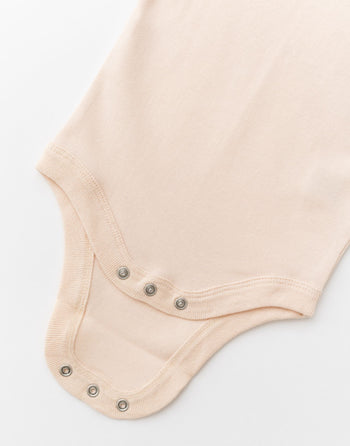 Kit & Petal Long Sleeve Bodysuit in Rosy Peach