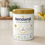 Kendamil premium toddler milk container on a kitchen counter
