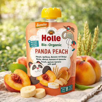 Holle organic panda peach baby food pouch with peaches and bananas on a natural background