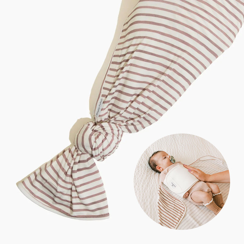 Rose Stripes Swaddle II one-piece baby swaddle blanket with snuggle band in off-white fabric with rose-colored stripes laid flat