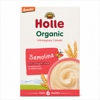 A box of Holle Organic Wholegrain Cereal Semolina, 6 months+, featuring a white background with red and green text, a bowl of beige cereal, and wheat ears.